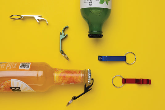 Recycled aluminum bottle and can opener attached to XD Collection lanyard, eco-friendly keychain accessory.