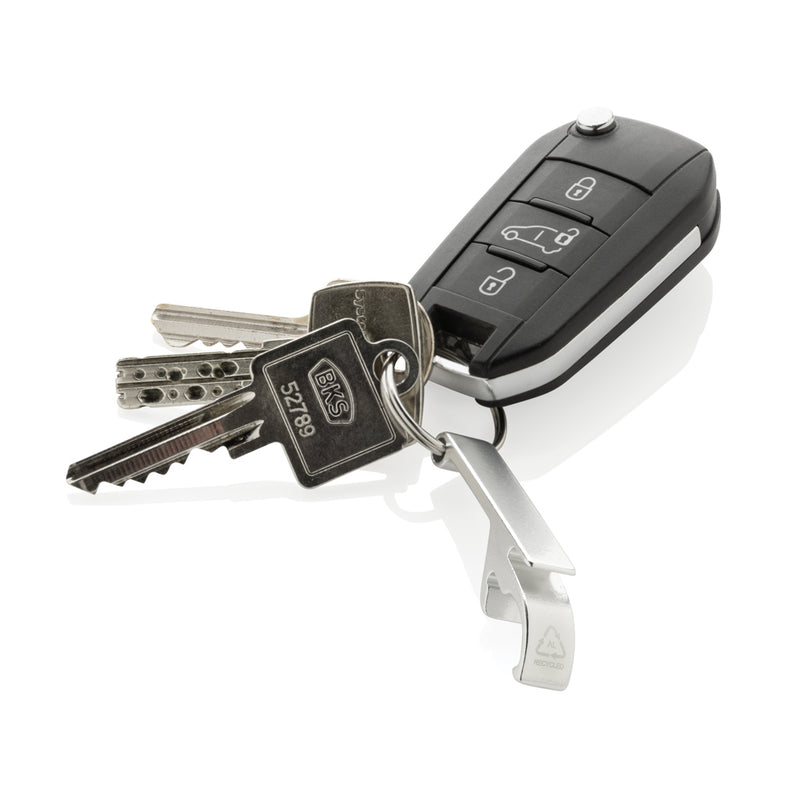Load image into Gallery viewer, XD Collection RCS recycled aluminum bottle and can opener attached to a lanyard, highlighting eco-friendly design and keychain functionality.

