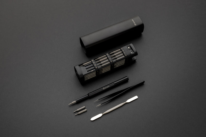 Load image into Gallery viewer, Gear X RCS recycled aluminum precision screwdriver set with 46 tools, featuring various bits and handles in a organized case.
