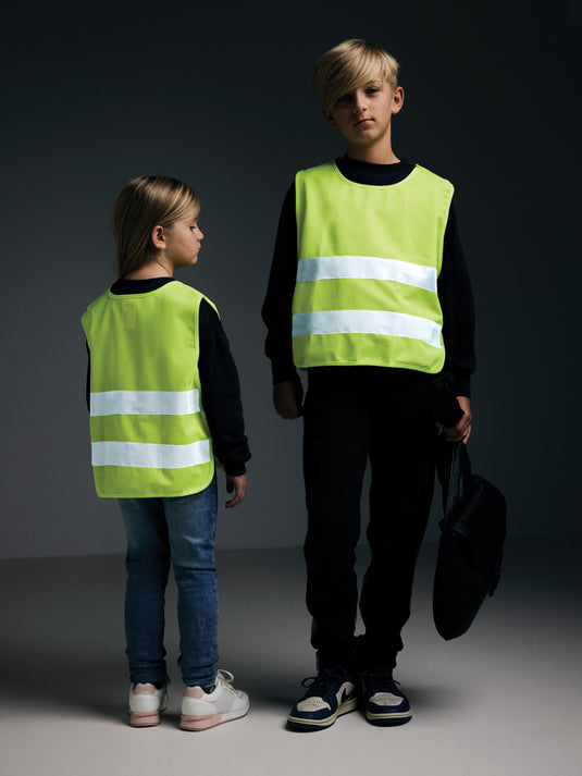 High-visibility safety vest for children ages 7-12 by XD Collection, made from recycled PET, featuring bright reflective material.