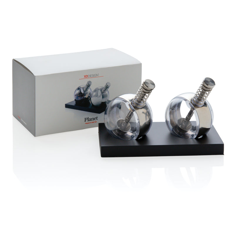 Load image into Gallery viewer, XD Design Planet pepper and salt set with matching ceramic shakers, designed for stylish kitchen or dining table use.

