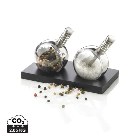 XD Design Planet pepper and salt set with round, colorful ceramic shakers on a wooden surface for home and kitchen use.