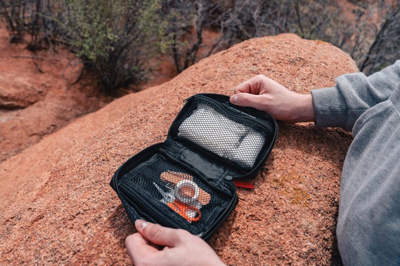Load image into Gallery viewer, XD Collection RCS recycled nubuck PU pouch containing a first aid kit for car and safety use, compact and durable emergency supplies.
