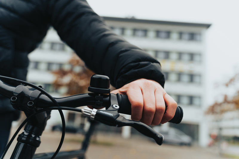 Load image into Gallery viewer, XD Collection Bike Finder Dual RCS bike bell with worldwide locating feature mounted on a bicycle handlebar.
