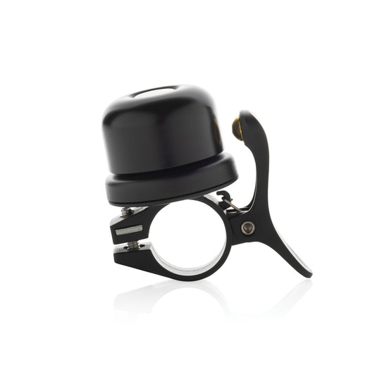 XD Collection Pedalfinder bike bell with worldwide locating feature on a bicycle handlebar, showcasing its compact design and branding.