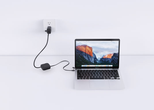 Urban Vitamin San Jose 100W stand with retractable cable for phones and tablets, showcasing sleek design and adjustable support.