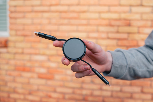 XD Xclusive Terra RCS recycled aluminium 6-in-1 45W retractable cable for phones and tablets, featuring multiple charging and data ports.