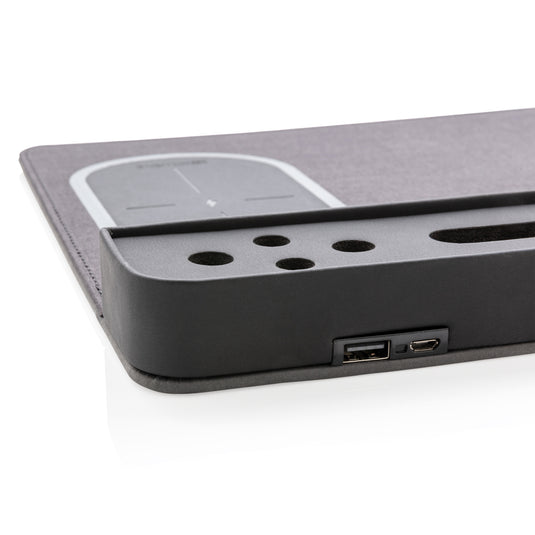 XD Xclusive air mousepad with wireless charging pad and USB port, designed for phones and tablets, shown on a workspace.