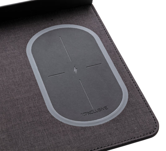 XD Xclusive air mousepad with wireless charging and USB port, designed for phones and tablets, with a sleek surface and charging area.