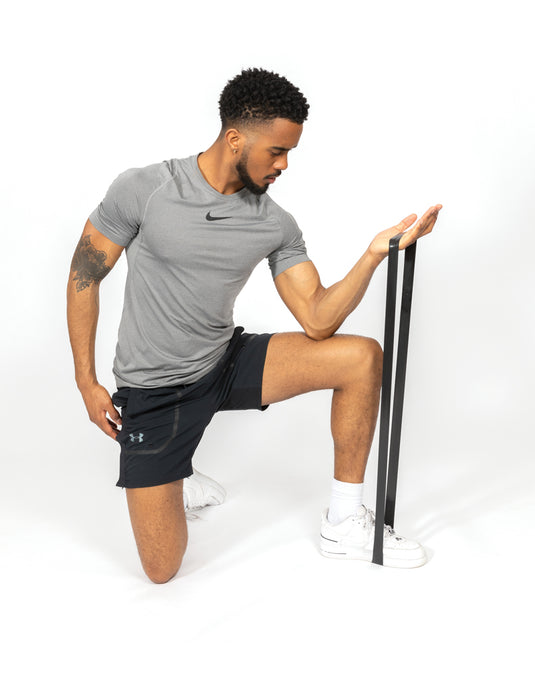 Set of four elastic fitness bands from XD Collection in a portable pouch for exercise and strength training.