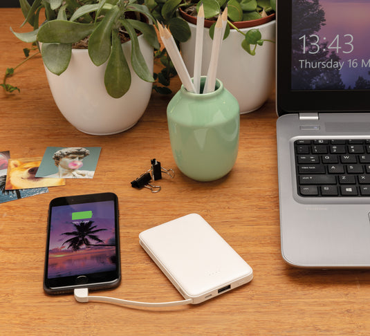 XD Collection 5,000 mAh pocket powerbank with built-in cables for phones and tablets, compact portable charging device.