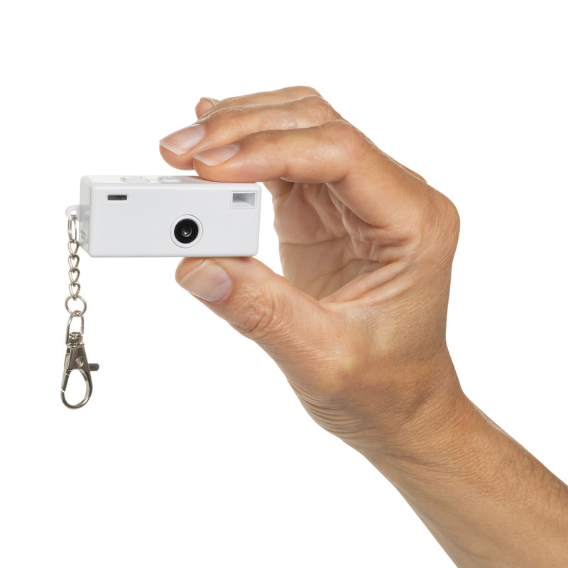 Load image into Gallery viewer, XD Xclusive Cliq it RCS recycled Keychain Camera attached to a phone, showcasing compact phone and tablet accessory with eco-friendly design.
