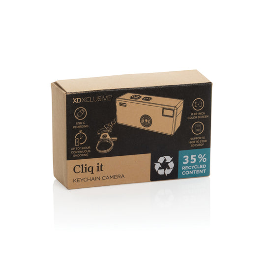 XD Xclusive Cliq it RCS recycled keychain camera attached to a phone, showcasing a compact phone and tablet accessory.