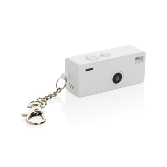 XD Xclusive Cliq it RCS recycled keychain camera attached to a phone, showcasing eco-friendly phone and tablet accessory design.