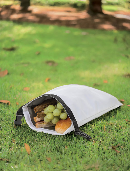 XD Collection AWARE™ RPET foldable lunch bag for outdoor use, featuring a compact 30x20cm design with a snack strap.