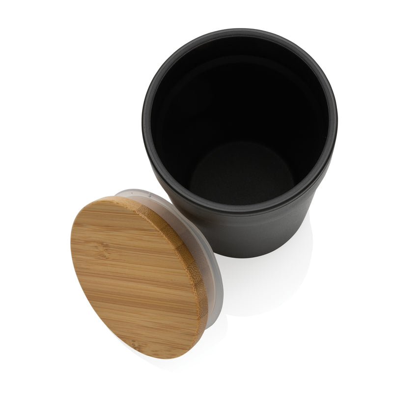 Load image into Gallery viewer, Recycled PP mug with bamboo lid from XD Collection, eco-friendly drinkware made from GRS certified recycled plastic.
