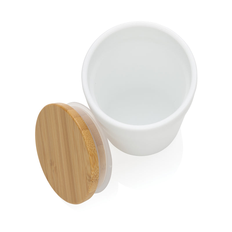 Load image into Gallery viewer, XD Collection GRS certified recycled polypropylene mug with bamboo lid, showcasing eco-friendly drinkware with a sleek design.
