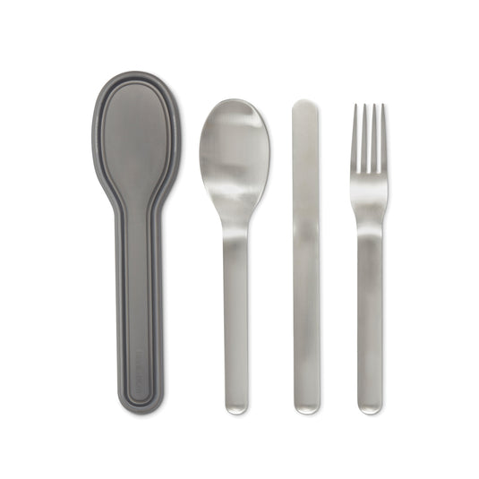 Black+Blum outdoor cutlery set featuring stainless steel forks, knives, and spoons arranged on a wooden surface.