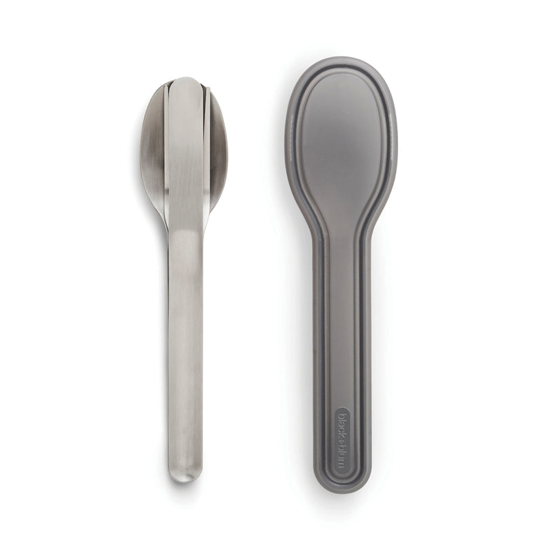 Load image into Gallery viewer, Black+Blum outdoor cutlery set with stainless steel forks, knives, and spoons arranged on a wooden surface.
