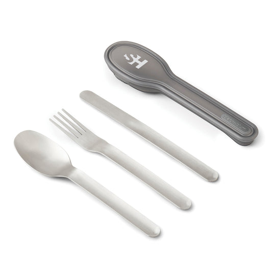 Black + Blum outdoor cutlery set with stainless steel utensils and black handles, ideal for camping and outdoor dining.