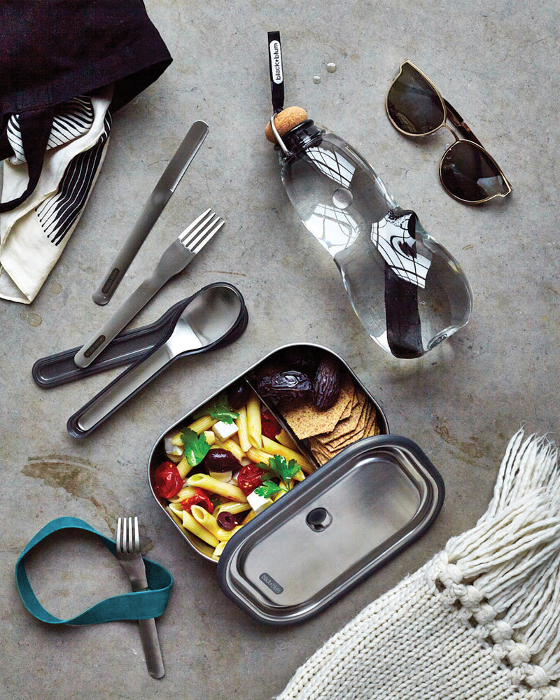Load image into Gallery viewer, Black + Blum outdoor cutlery set with black handles, including fork, knife, and spoon, designed for portable outdoor dining.

