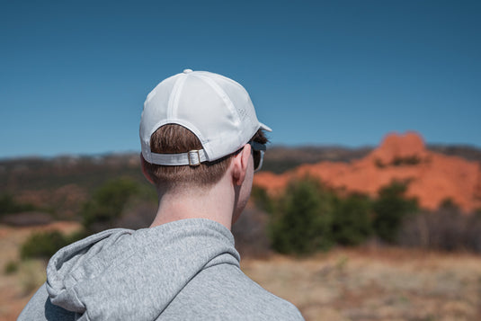 Impact AWARE™ RPET 6-panel sports cap by XD Collection, showing a lightweight, eco-friendly headwear with a curved brim and adjustable strap.