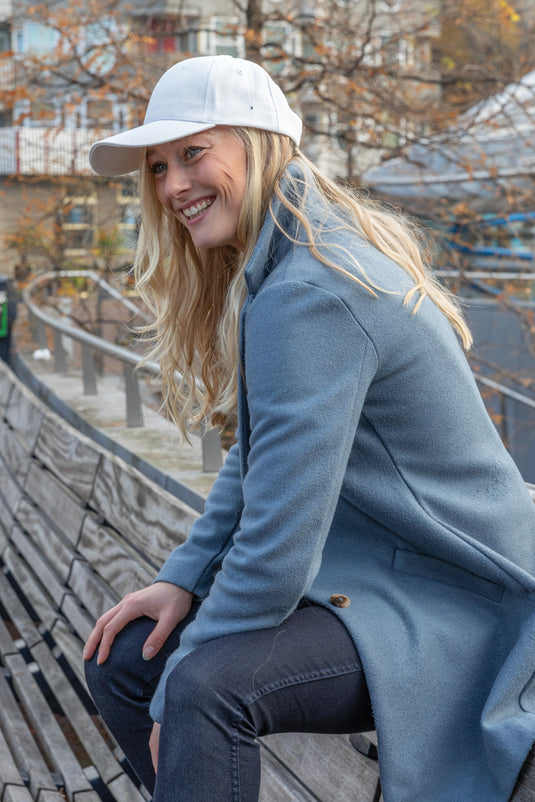 Six-panel recycled cotton cap with AWARE™ tracer by XD Collection, showcasing its casual headwear design and eco-friendly material.