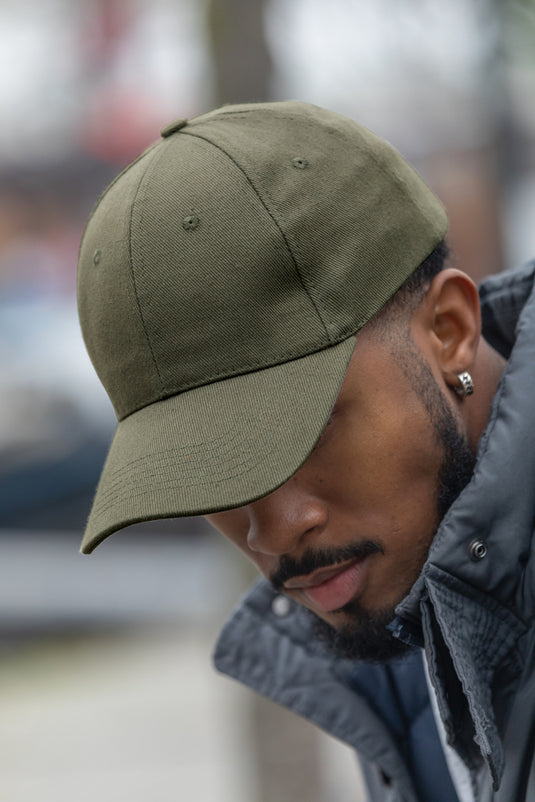 Six-panel recycled cotton cap from XD Collection with AWARE™ tracer, showcasing its casual headwear design and eco-friendly materials.