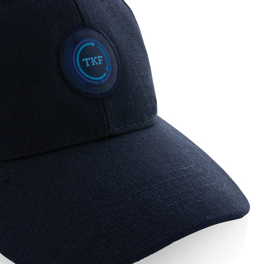 Six-panel recycled cotton cap from XD Collection with AWARE™ tracer, showcasing its eco-friendly design and casual headwear style.