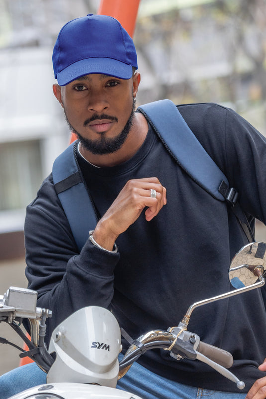 XD Collection 5-panel recycled cotton cap with AWARE™ tracer, showcasing a stylish headwear design in natural colors.