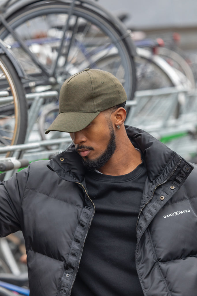 Load image into Gallery viewer, Recycled cotton 5-panel cap with AWARE™ tracer from XD Collection, showcasing its eco-friendly design and adjustable fit.
