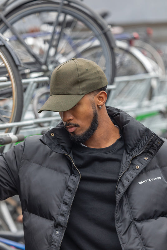 Recycled cotton 5-panel cap with AWARE™ tracer from XD Collection, showcasing its eco-friendly design and adjustable fit.
