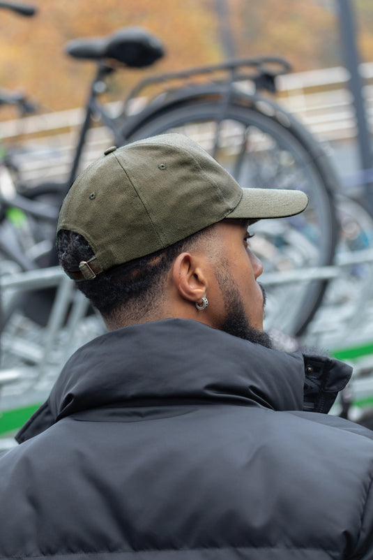 XD Collection 5-panel recycled cotton cap with AWARE™ tracer, showcasing eco-friendly headwear in a stylish design.