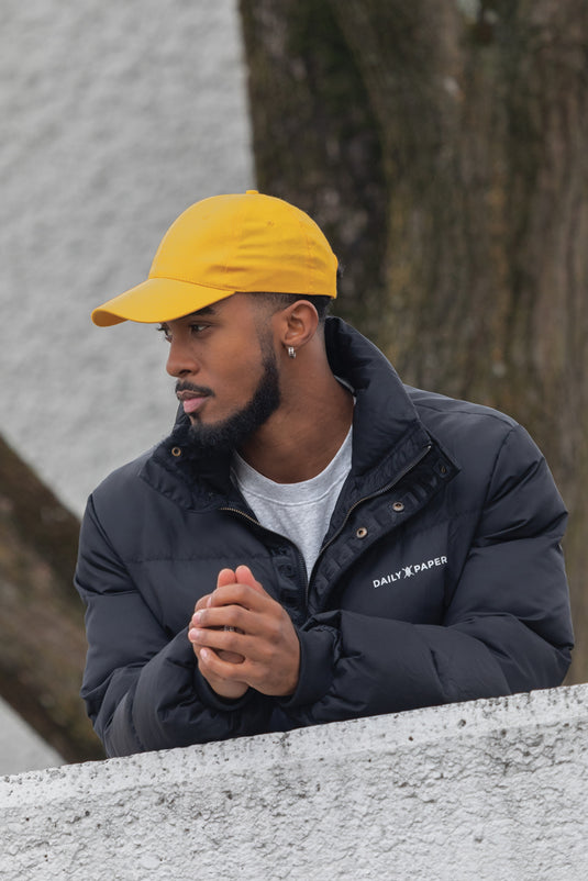 Six-panel recycled cotton cap by XD Collection with AWARE™ tracer, showcasing a casual headwear design in natural fabric.
