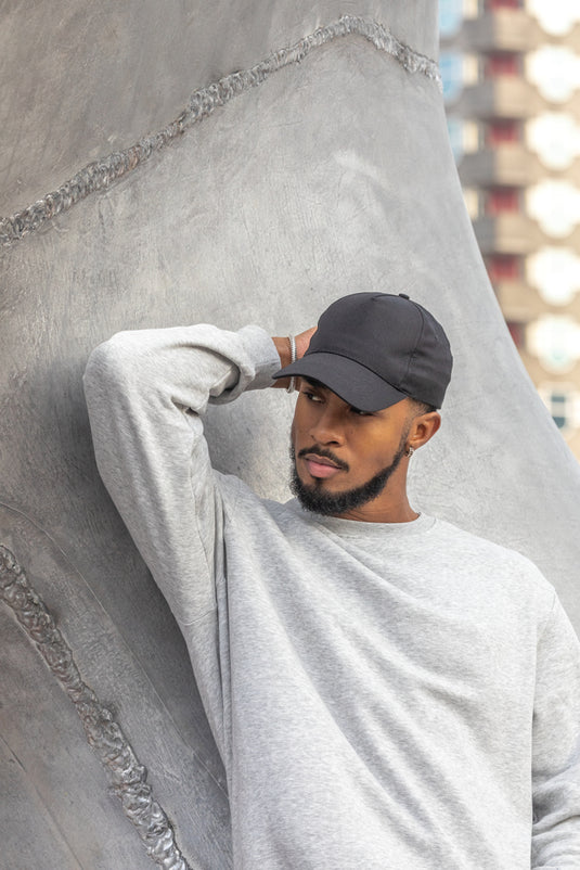 XD Collection Impact 5-panel recycled cotton cap with AWARE™ tracer, showcasing durable headwear design and eco-friendly materials.