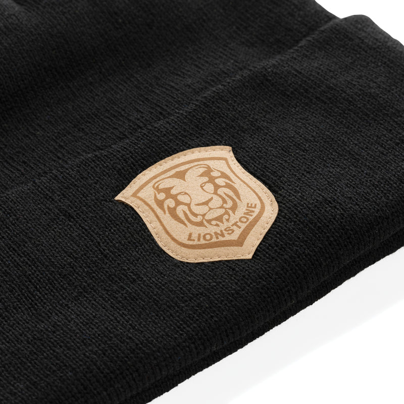 Load image into Gallery viewer, Polylana® beanie headwear in neutral color from XD Collection, soft knit fabric, close-up view showing cozy design.
