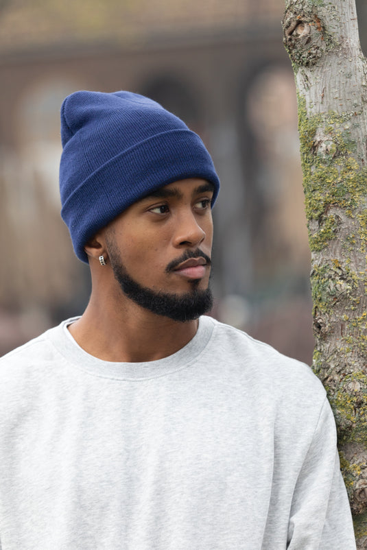 XD Collection Polylana® beanie headwear in soft knit fabric, displayed on a neutral background.