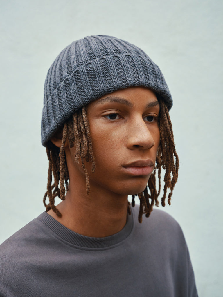 Load image into Gallery viewer, XD Collection Kennedi AWARE™ Polylana® beanie with large rib, cozy headwear in neutral tones showing its textured knit design.
