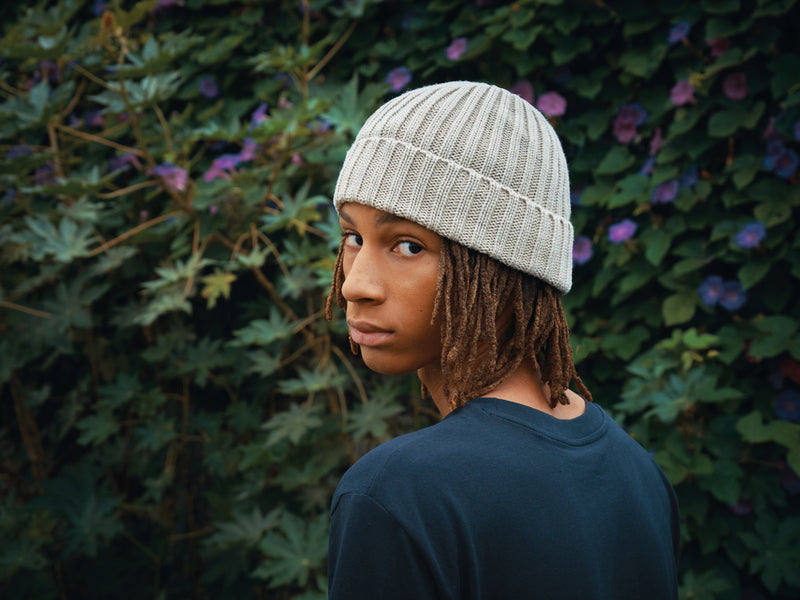 Load image into Gallery viewer, XD Collection Kennedi AWARE™ Polylana® beanie with large rib, soft headwear in a cozy knit style, shown on a model.

