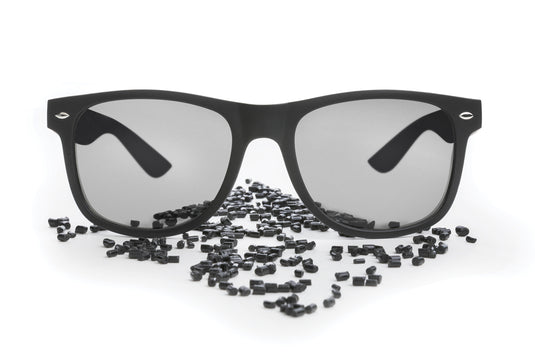 Pair of XD Collection GRS recycled PC plastic outdoor sunglasses with black frames and tinted lenses, designed for sun protection.