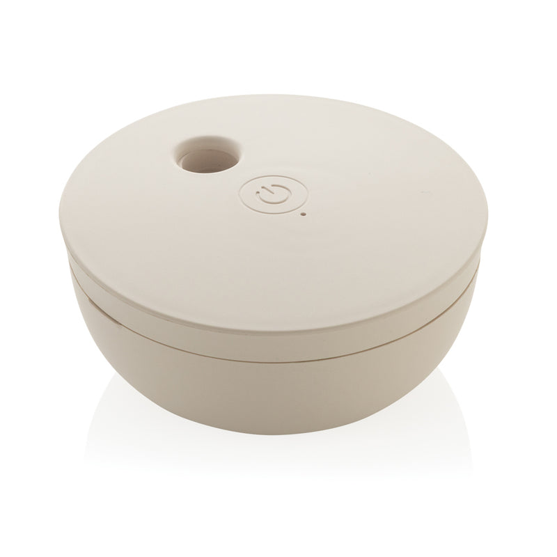 Load image into Gallery viewer, XD Collection Breevia RCS rechargeable floating humidifier with water tank and digital controls in a home setting
