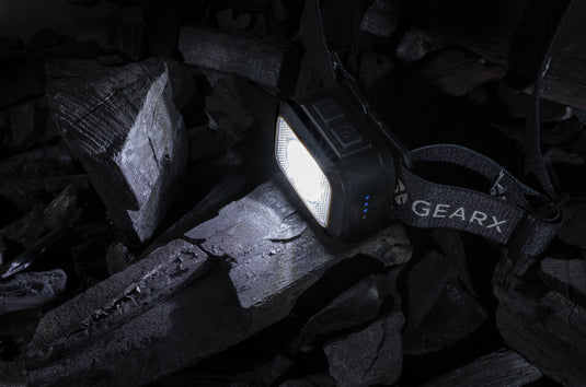 Gear X RCS plastic heavy-duty head torch with adjustable strap and bright LED light for outdoor and industrial use.