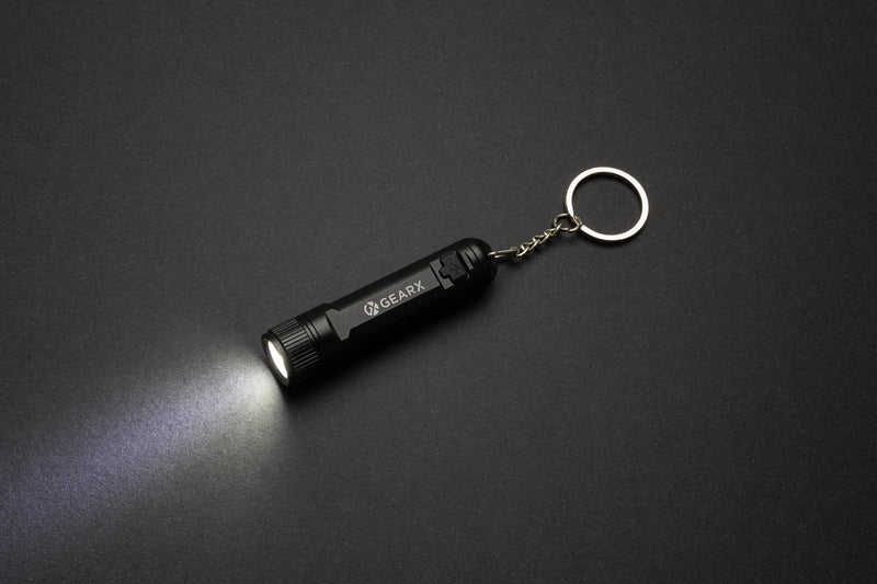 Load image into Gallery viewer, GearX rechargeable ultra bright keychain torch showing compact design with bright LED light and keyring attachment.
