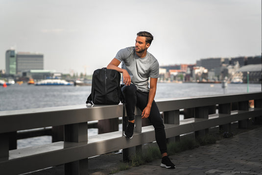 XD Design Flex Gym bag for travel and workouts, featuring a sleek black design with multiple compartments and adjustable straps.