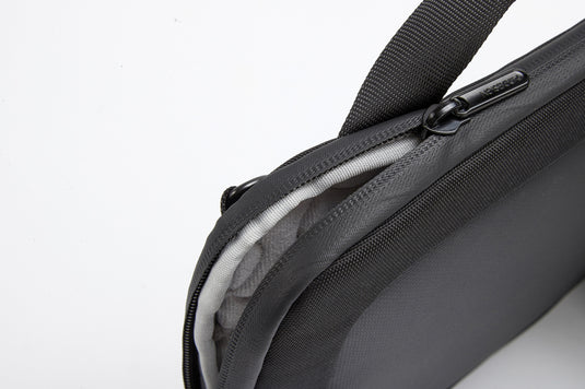 XD Design 14-inch laptop bag with padded compartments and sleek black nylon exterior, designed for travel and everyday use.