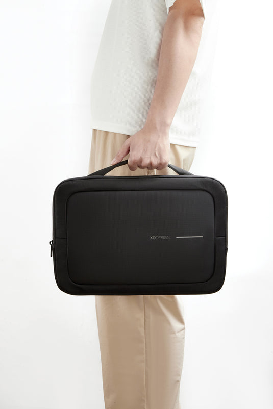 XD Design 14-inch laptop bag in black with adjustable strap and multiple compartments for travel and daily use.