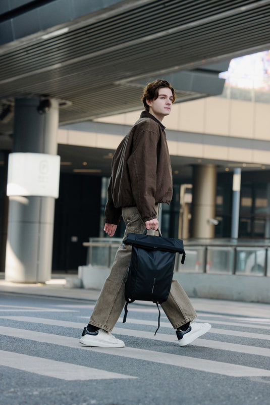 Urban water-resistant bike backpack by XD Design featuring multiple compartments and adjustable straps for cycling convenience.