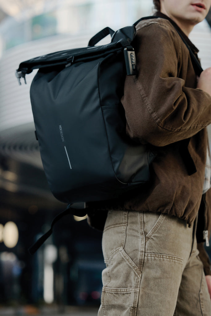 Load image into Gallery viewer, Urban water-resistant bike backpack by XD Design with multiple compartments and reflective details for safe cycling.
