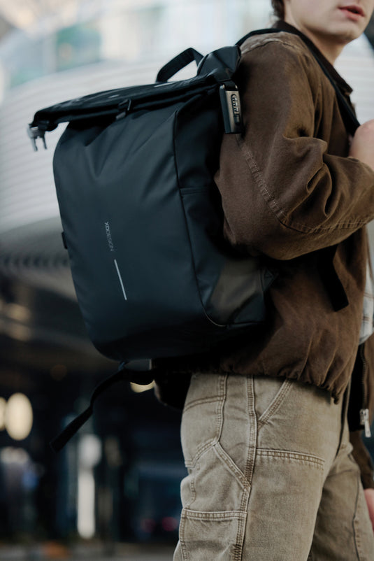 Urban water-resistant bike backpack by XD Design with multiple compartments and reflective details for safe cycling.