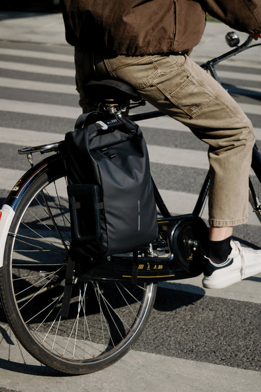 Urban water-resistant bike backpack by XD Design with multiple compartments and sturdy straps for secure cycling storage.